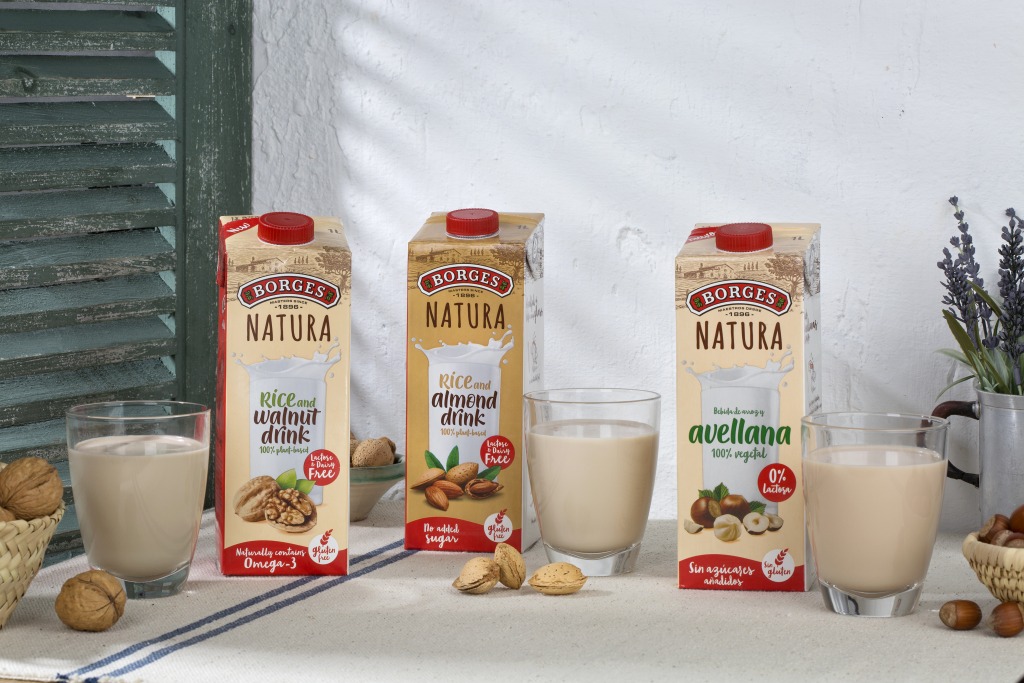 Vegetable drinks of almonds, walnuts and hazelnuts on a table