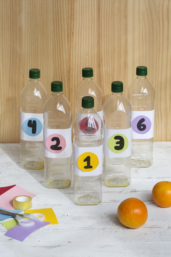 plastic bottles as bowling pins to have a bowling alley at home