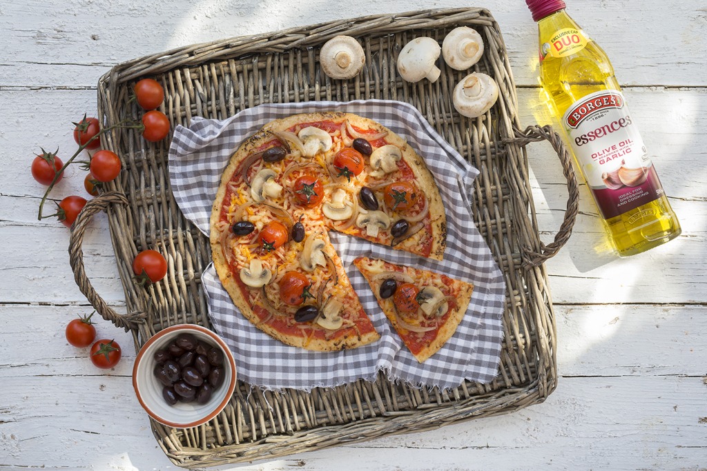 Mushroom and fresh tomato pizza with a little garlic olive oil