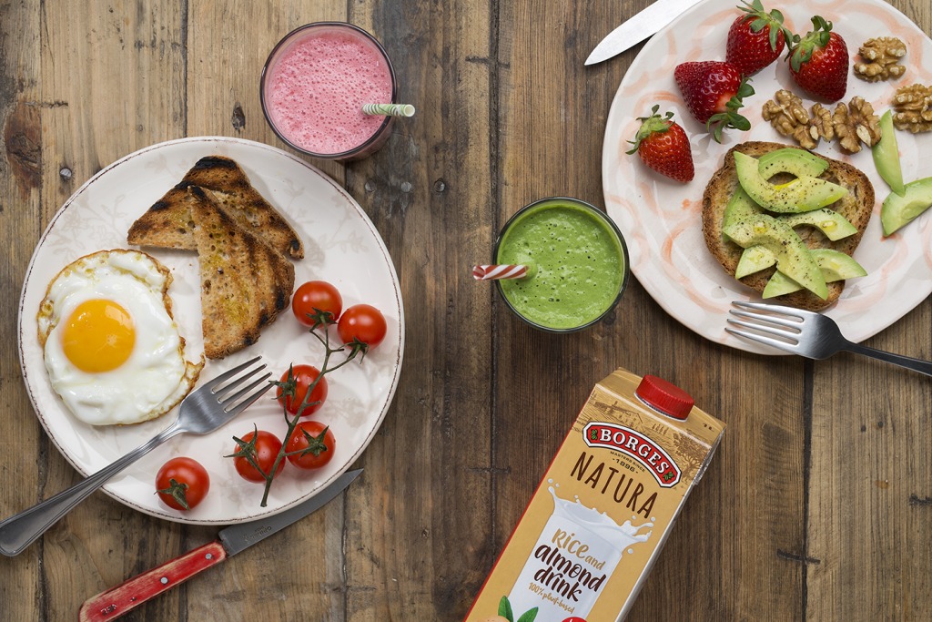 fried egg on a toast with avocado and and energetic smoothie with vegetable drink