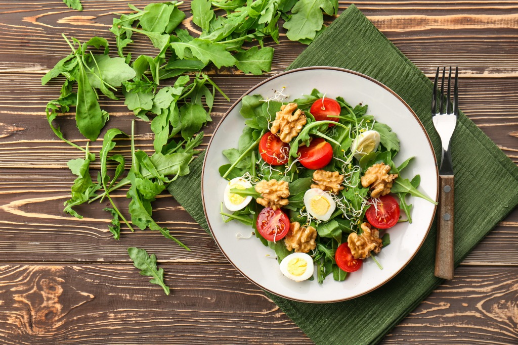 salad with nuts, tomates, boiled eggs and Borges dressings