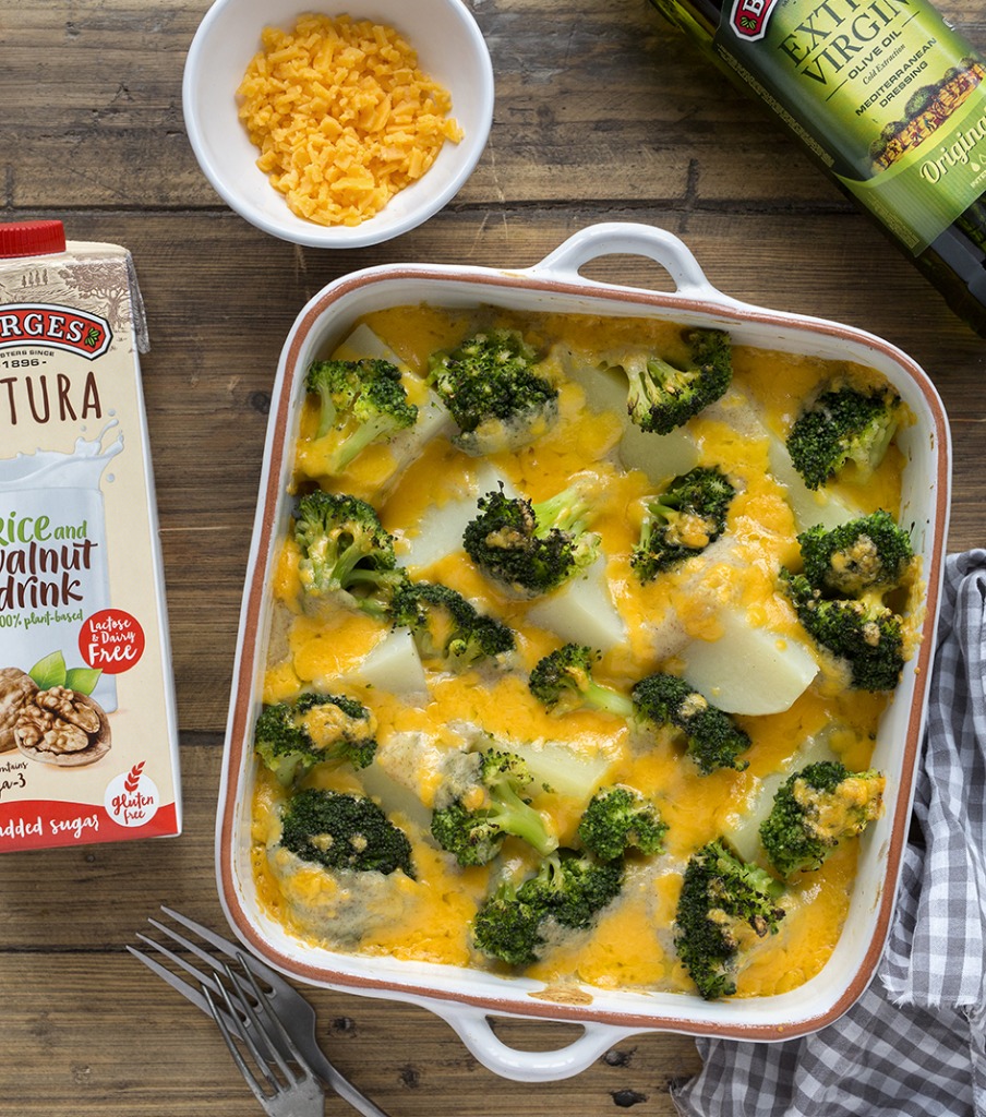 Baked potatoes with cheese and broccoli served in an oven tray