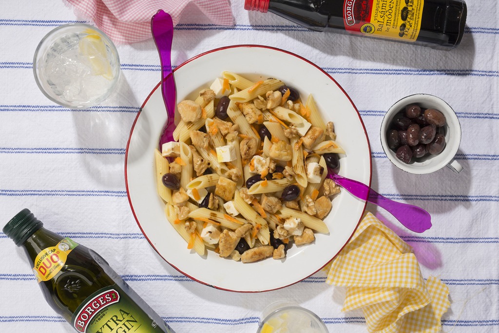 A plate of salad for kids made of penne, chicken and feta cheese