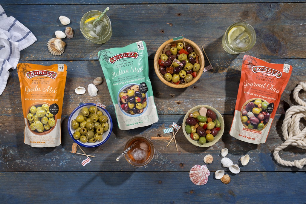 The new appetiser of Borges: Three Kinds of olives with different flavors in their packaging and served on bowls