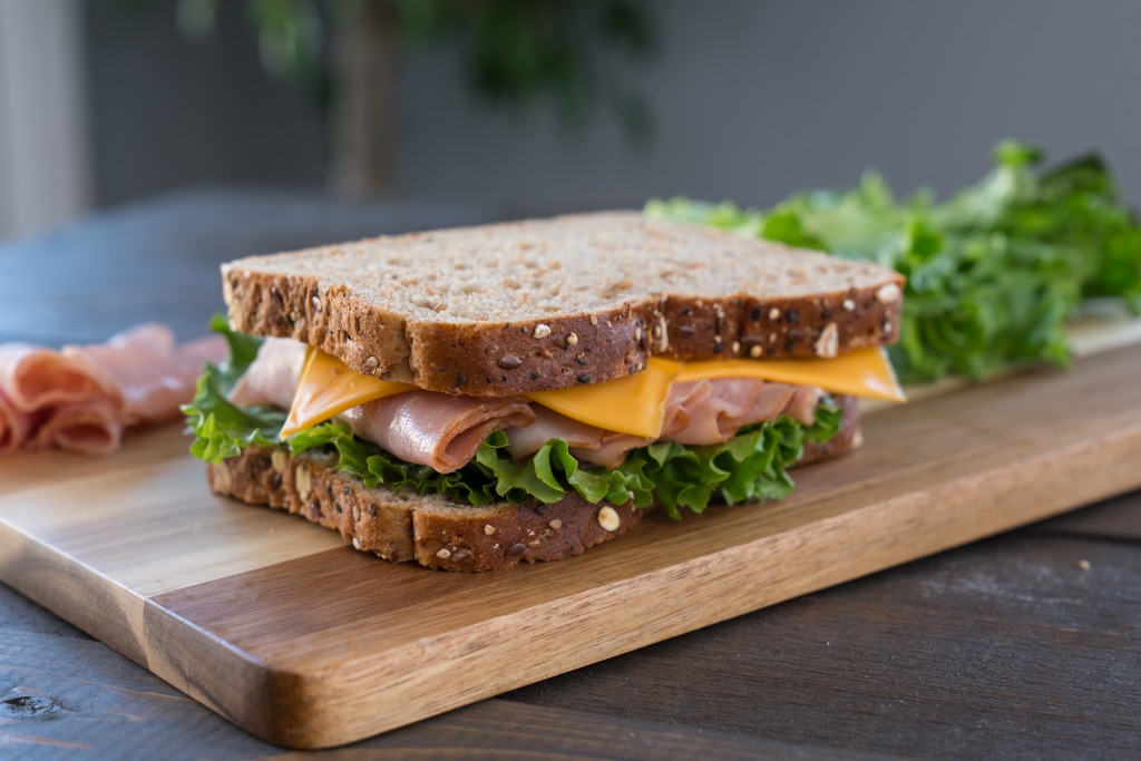 Cheese, lettuce and ham sandwich with oil. A quick and healthy breakfast