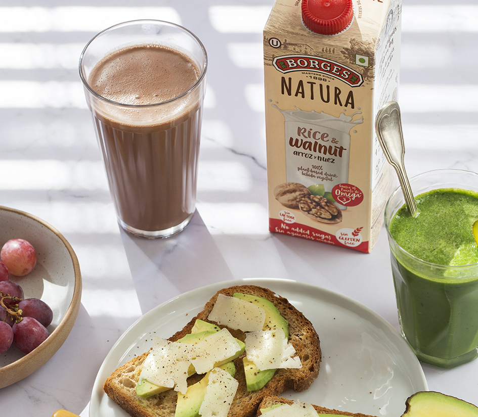 Perfect breakfast: Toast with avocado and parmesan cheese and a walnut drink