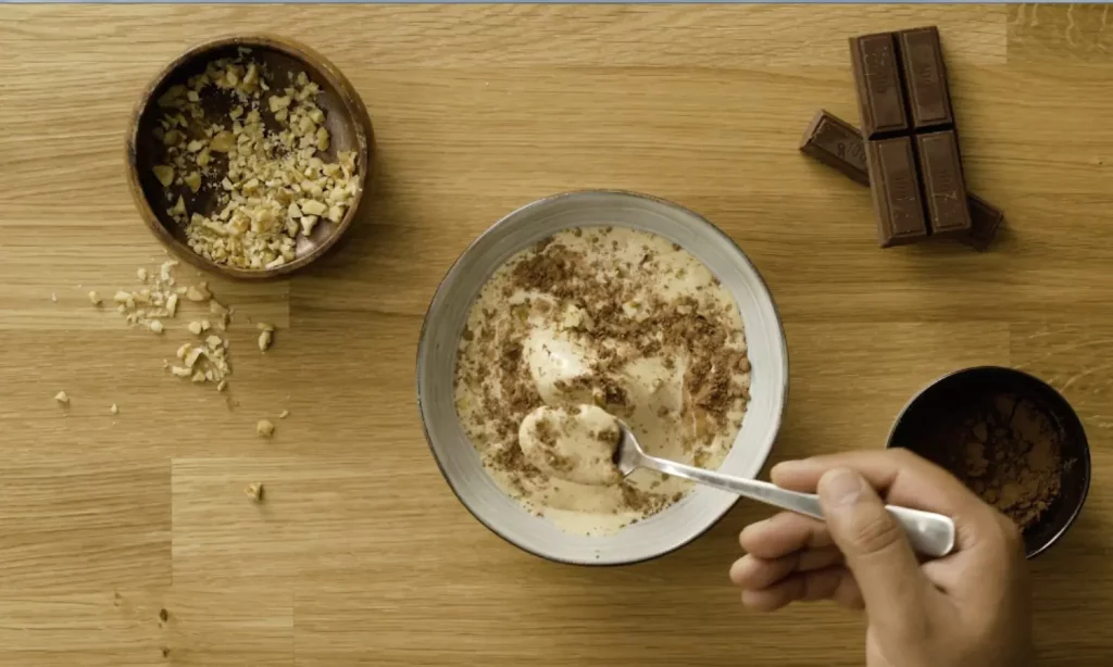 Walnut ice cream recipe served in a bowl with nuts topping