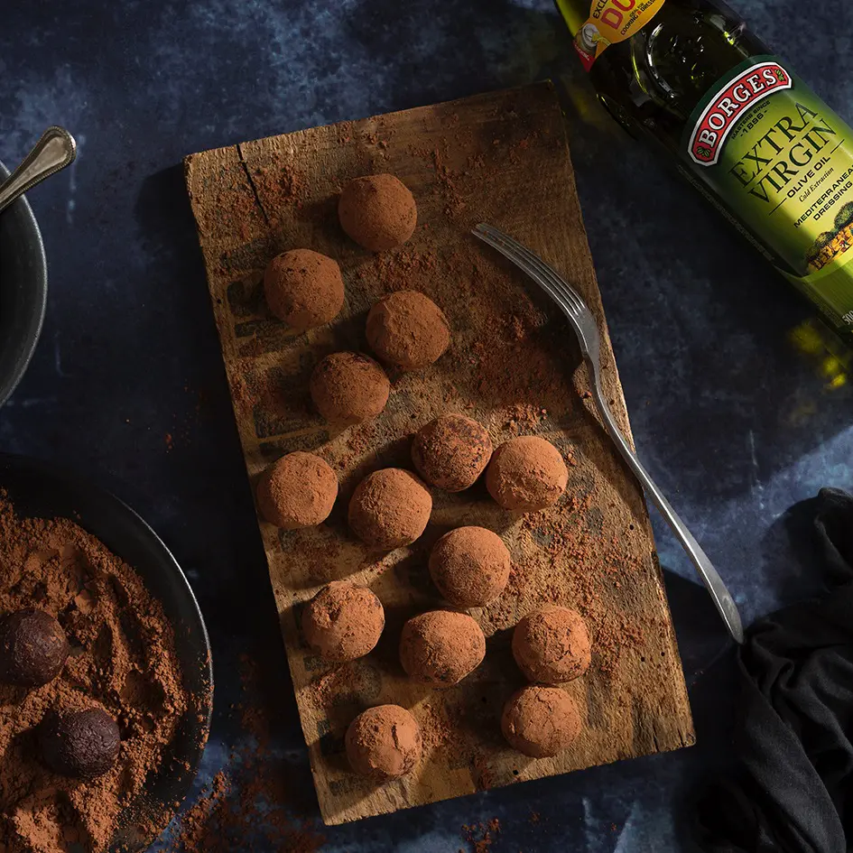chocolate truffles on a wooden tray
