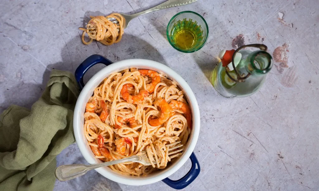 Creamy prawn pasta recipe served in a vintage style pot