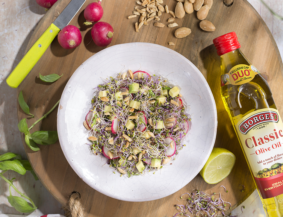 Salad with nuts, radishes, avocado and aromatic herbs