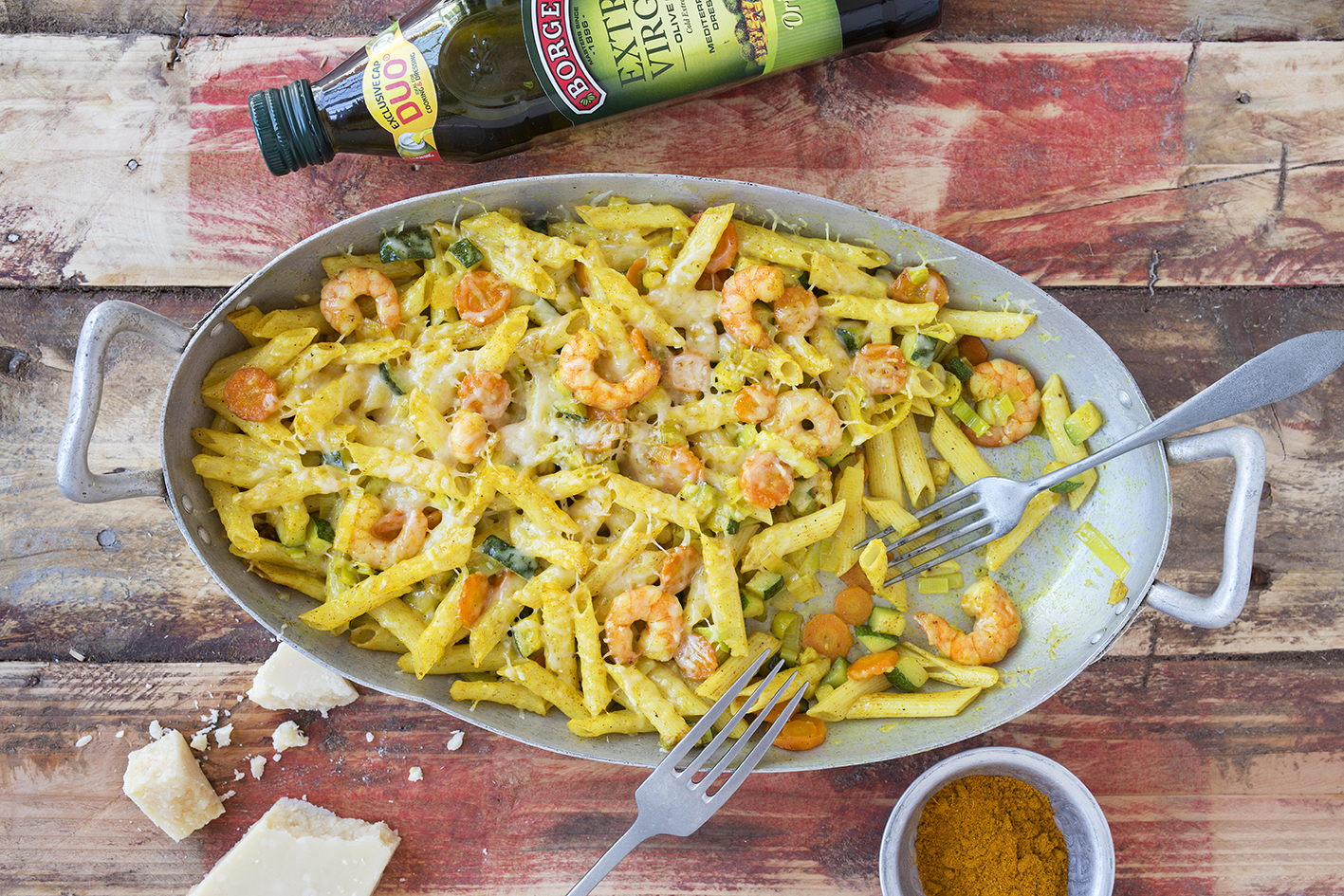 Baked pasta with vegetables and prawns recipe served in an oven tray