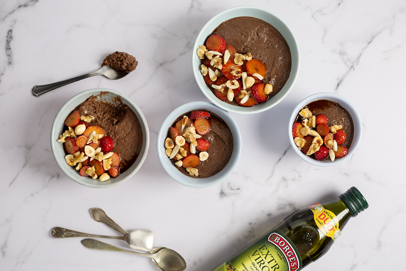 Chocolate mousse and strawberries served in bowls